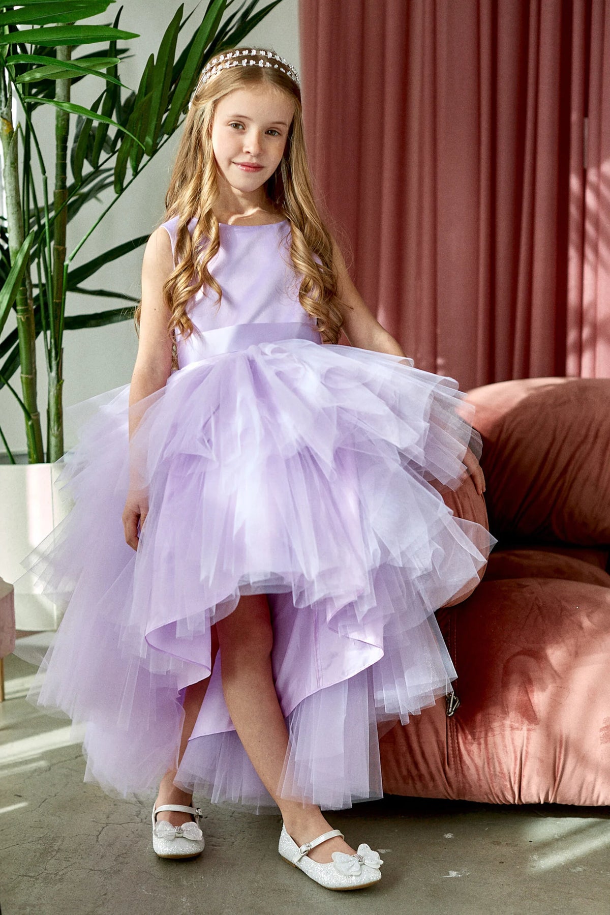 The Lilac kids pageant dress has a satin bodice and layered high-low tulle.
