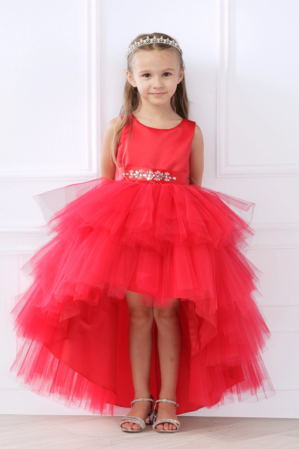 Red kids pageant dress featuring a satin bodice and layered high-low tulle.