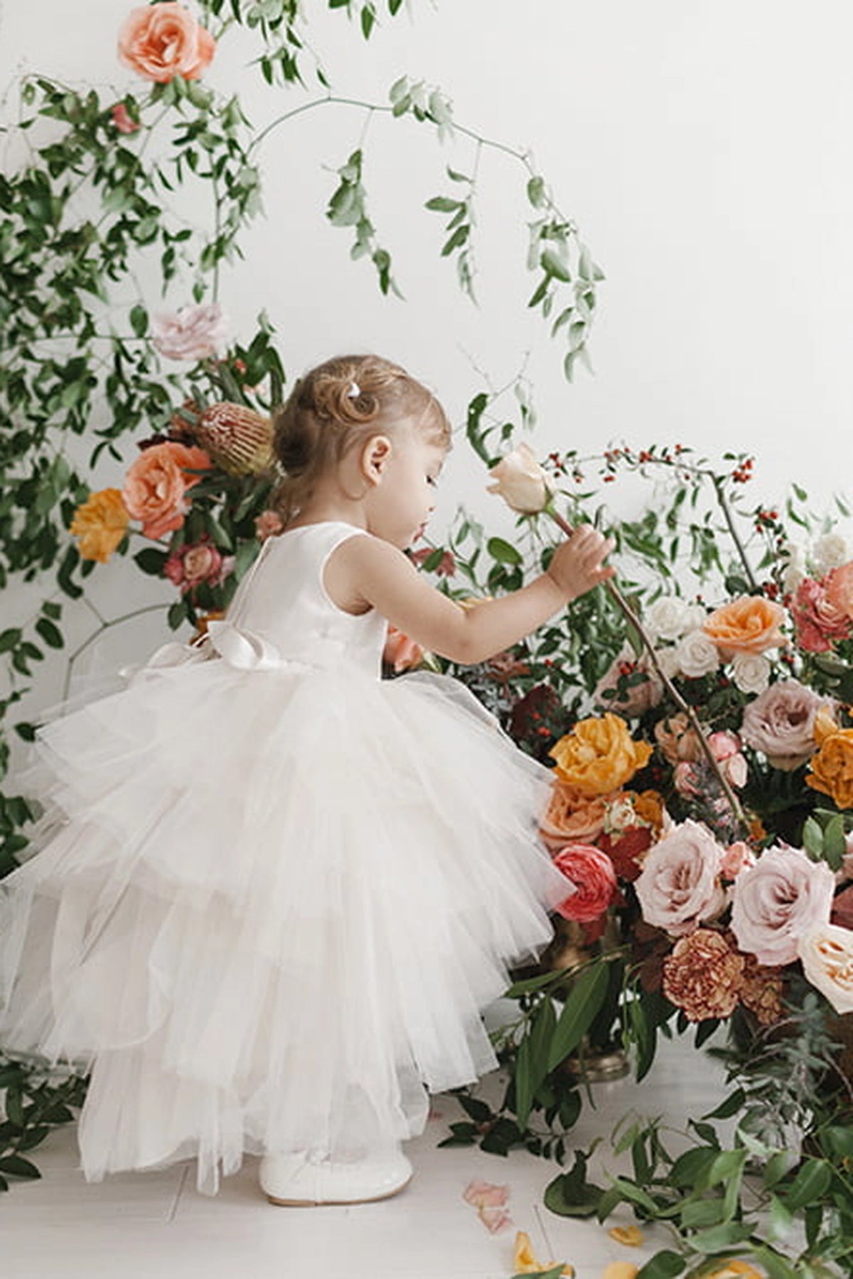 Another view of the Ivory kids pageant dress shows a satin bodice and layered high-low tulle.