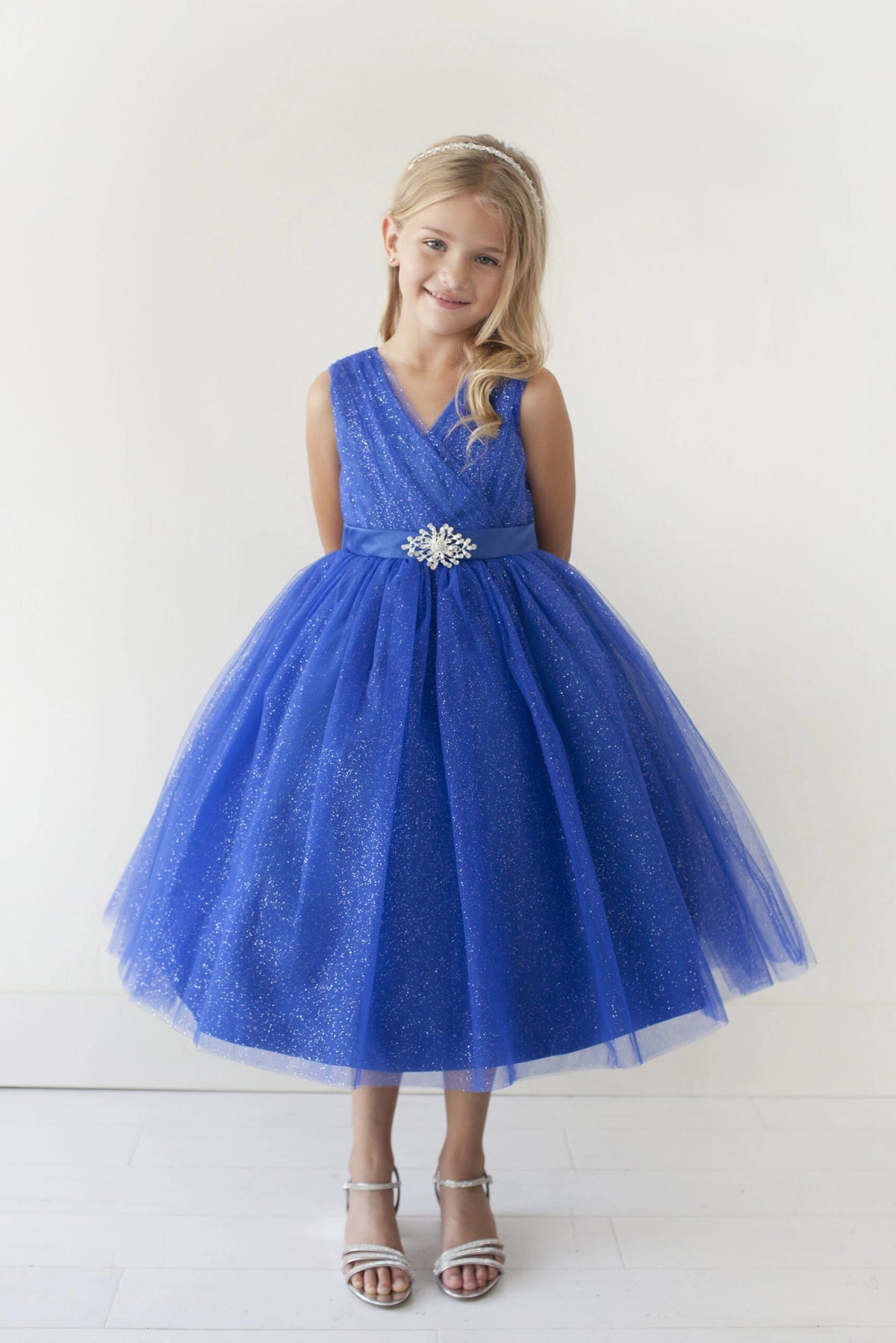 Royal Blue kids pageant dress featuring a ruched V-neckline and rhinestone brooch.