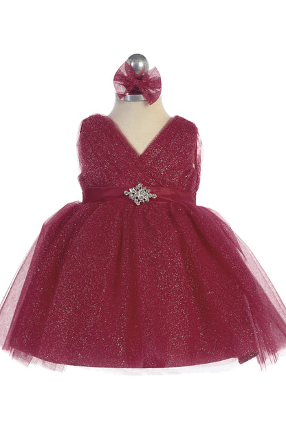 The Burgundy kids pageant dress has a ruched V-neckline and rhinestone brooch.