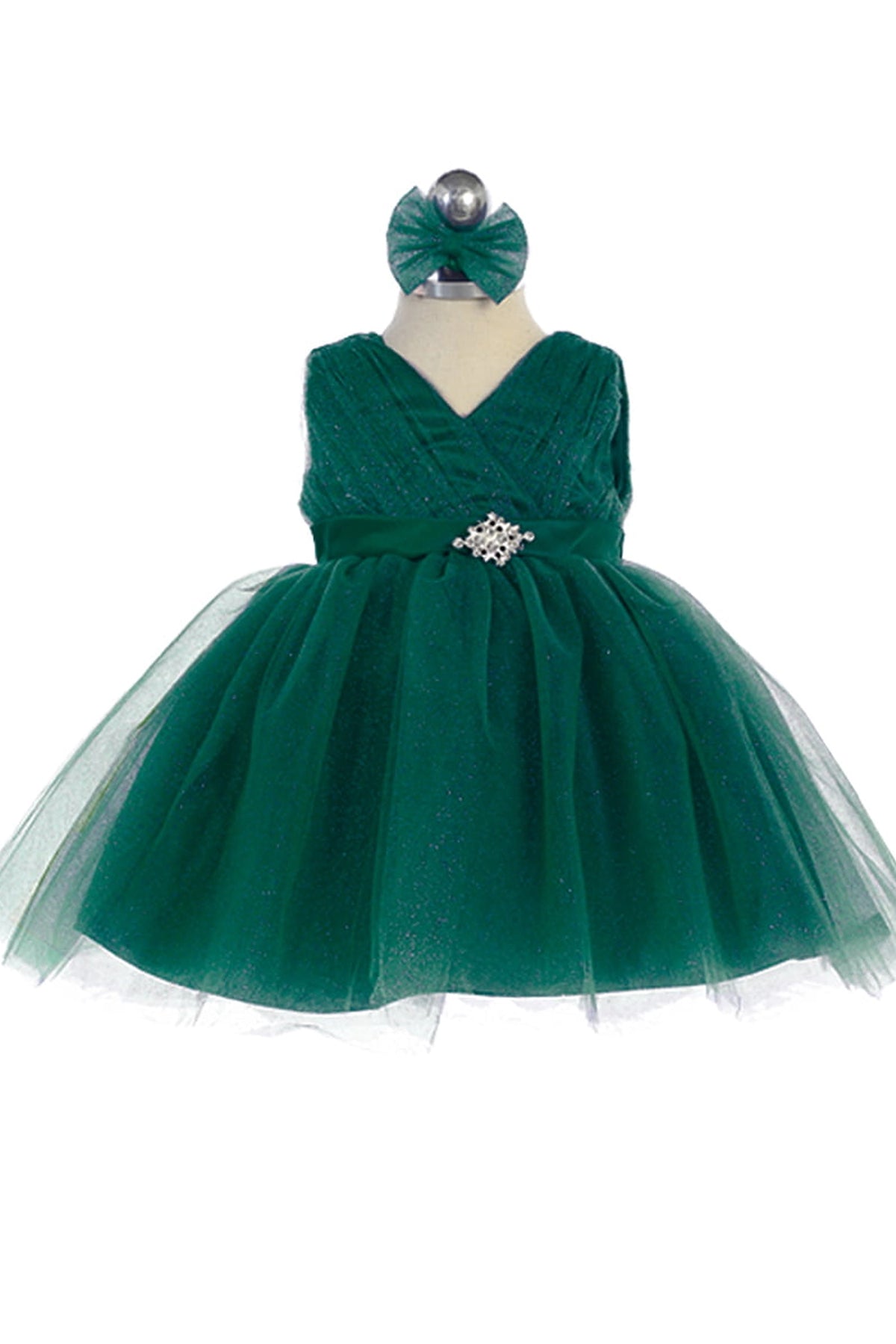 The Emerald kids pageant dress has a ruched V-neckline and rhinestone brooch.