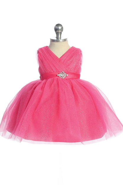 Visible details on the Fuchsia kids pageant dress include a ruched V-neckline and rhinestone brooch.