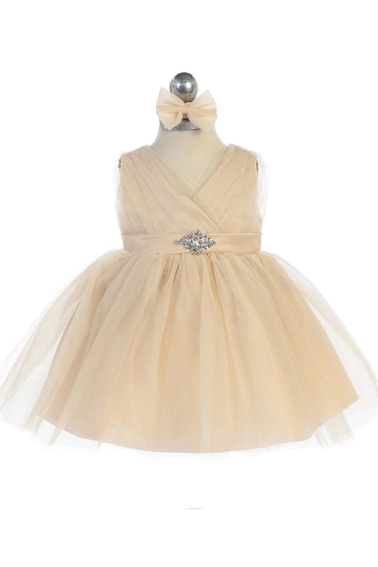 Gold kids pageant dress featuring a ruched V-neckline and rhinestone brooch.