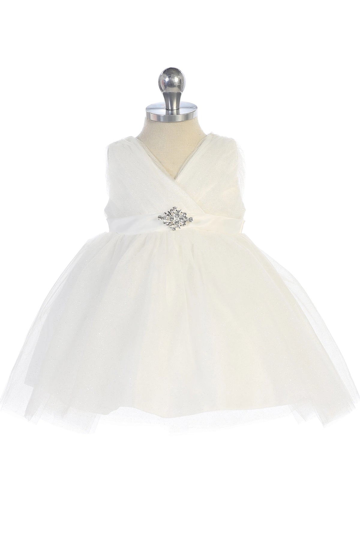 Seen from the front, this Ivory kids pageant dress displays a ruched V-neckline and rhinestone brooch.