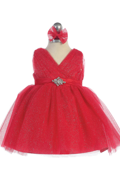 The Red kids pageant dress has a ruched V-neckline and rhinestone brooch.