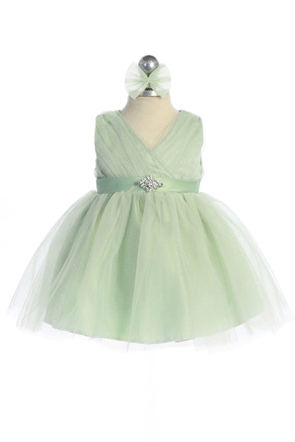 Visible details on the Sage kids pageant dress include a ruched V-neckline and rhinestone brooch.