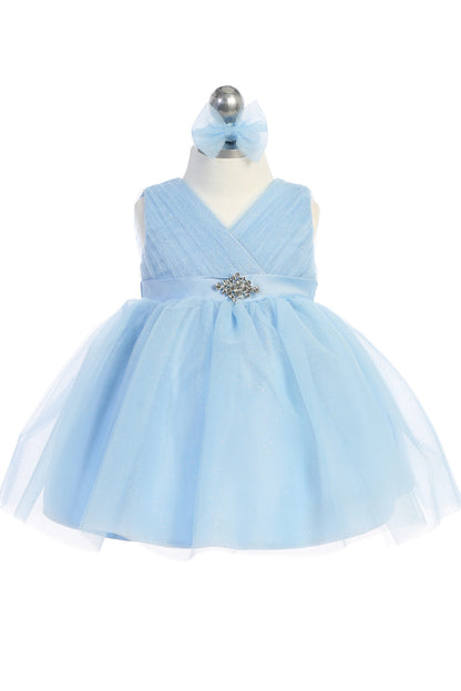 Seen from the front, this Sky Blue kids pageant dress displays a ruched V-neckline and rhinestone brooch.