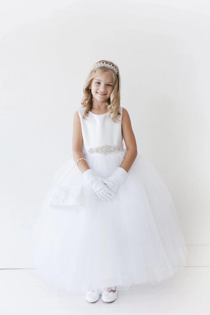 Emphasis on a smooth sleeveless bodice of the white flower girl dress.