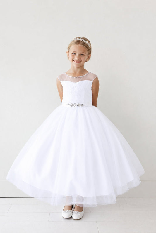 White flower girl dress with a softly flared tulle hem.