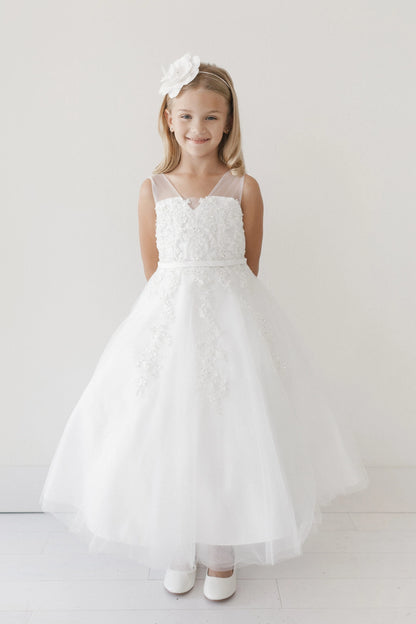 Embroidered vines trail down this off-white flower girl dress.