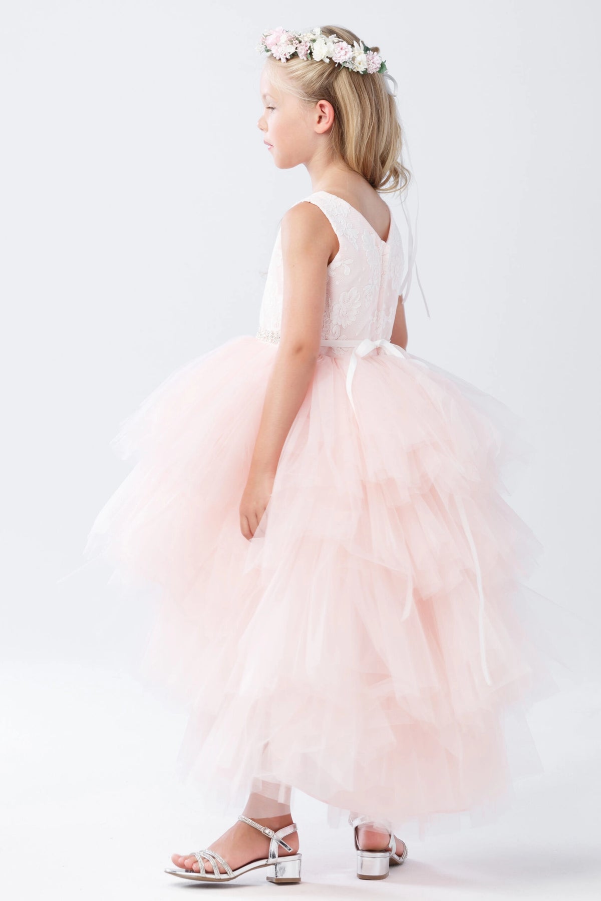 Blush flower girl dress detailed with a lace bodice.