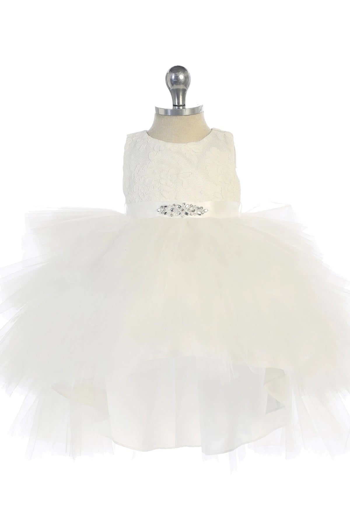 Defined by voluminous tulle layers, this off-white flower girl dress.