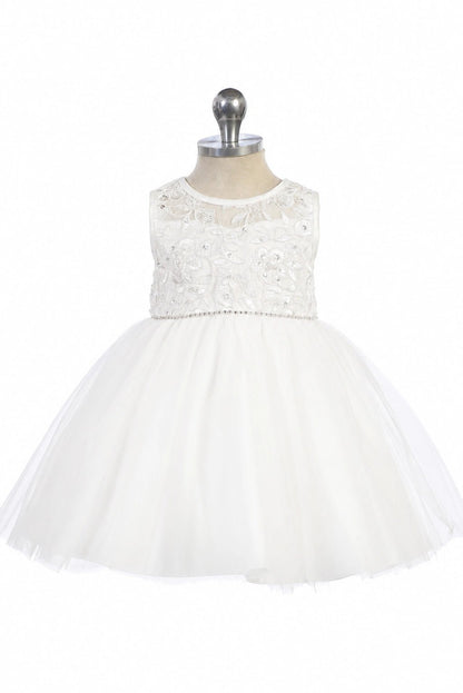 Narrow beaded waistband accents the off-white flower girl dress.