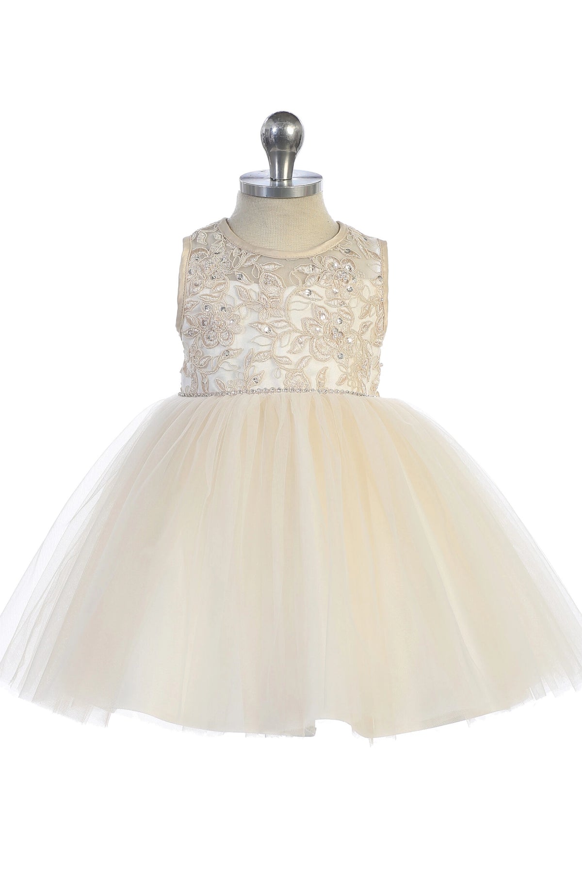 Gathered tulle skirt: detail of the champagne flower girl dress.