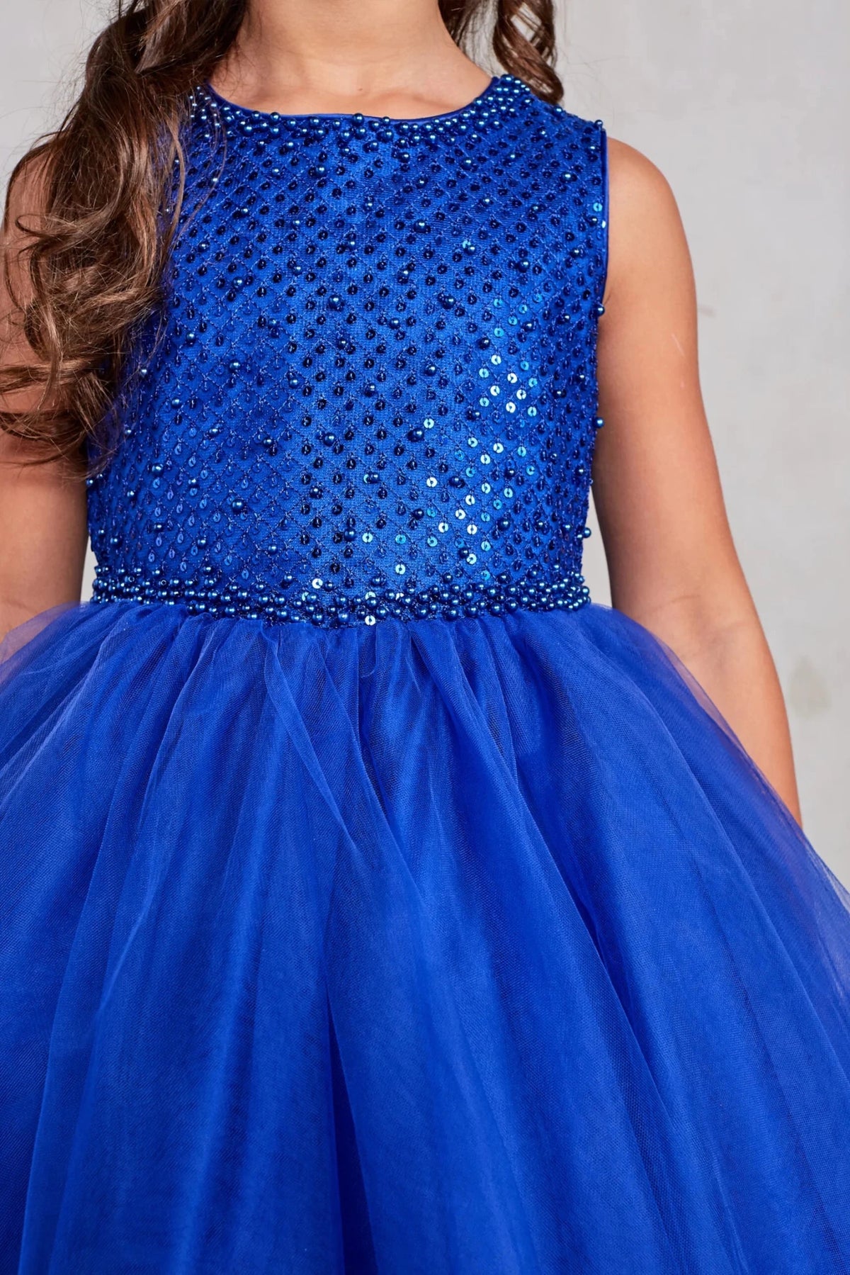 Diamond sequin bodice on a royal blue flower girl dress.