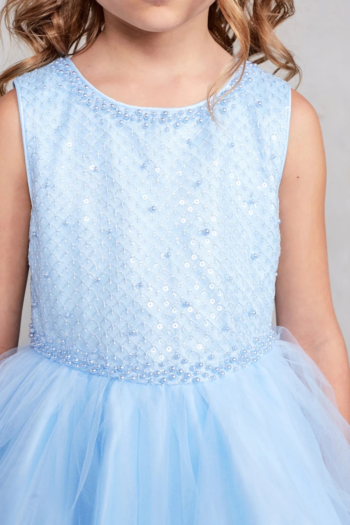 Visible on the sky blue flower girl dress: diamond-pattern beading.
