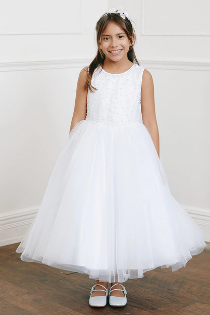 On this white flower girl dress, a beaded sleeveless bodice is visible.