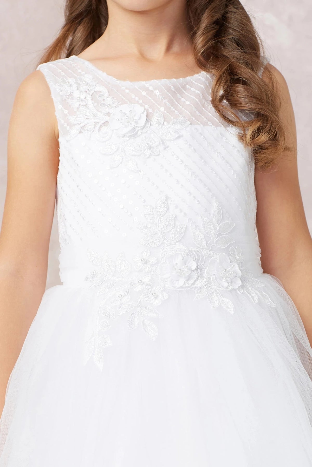 Diagonal bodice pleats accent this white flower girl dress.