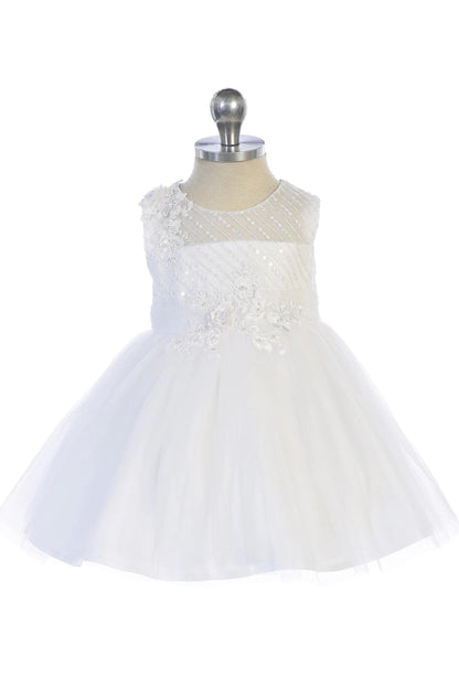 Emphasis on a textured floral bodice of the white flower girl dress.