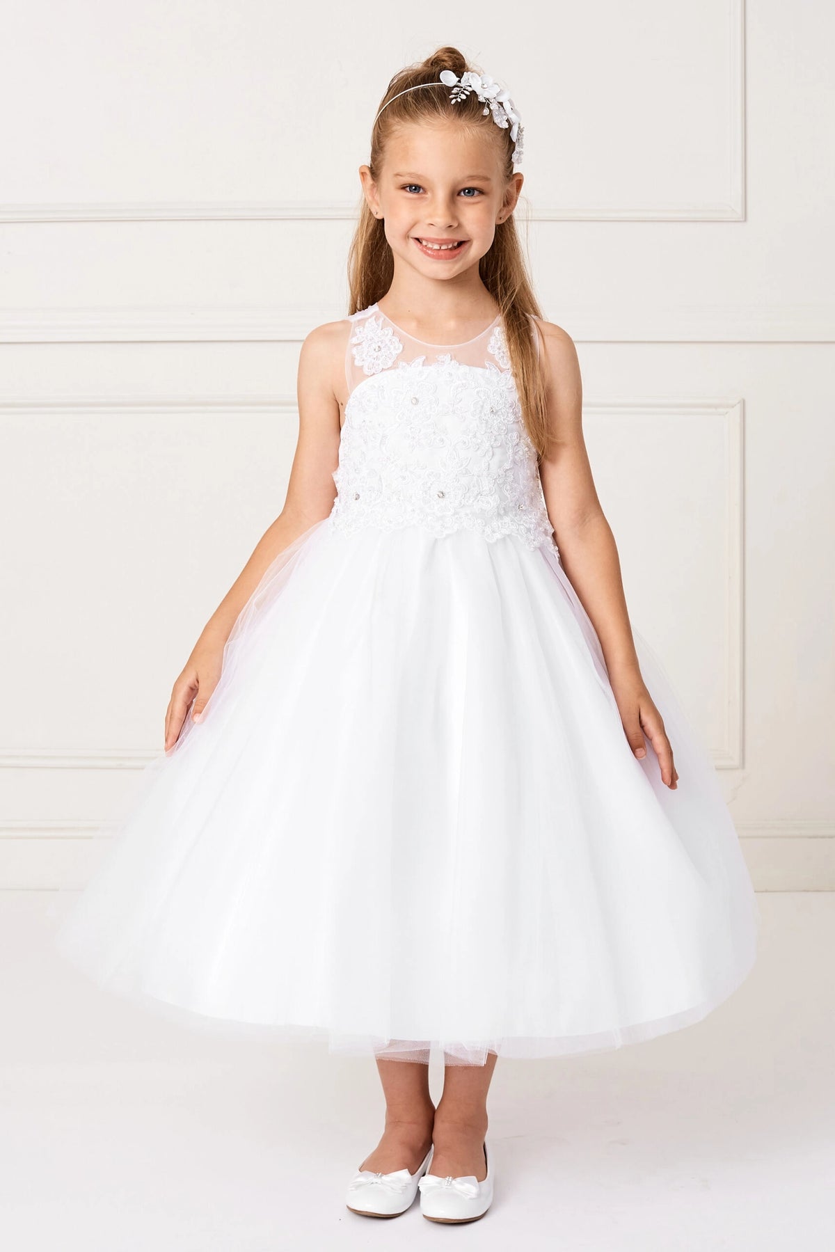 Detailed with floral bodice embroidery, this white flower girl dress.