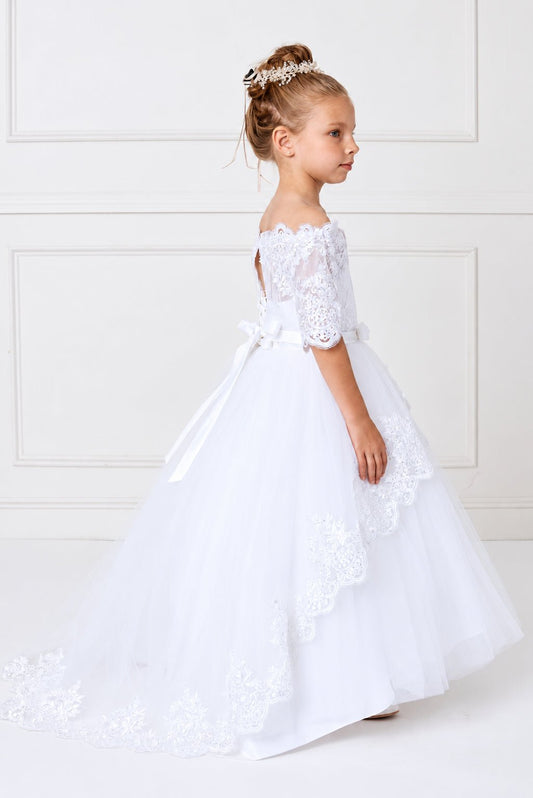 Lace drapes in scalloped tiers on this white flower girl dress.