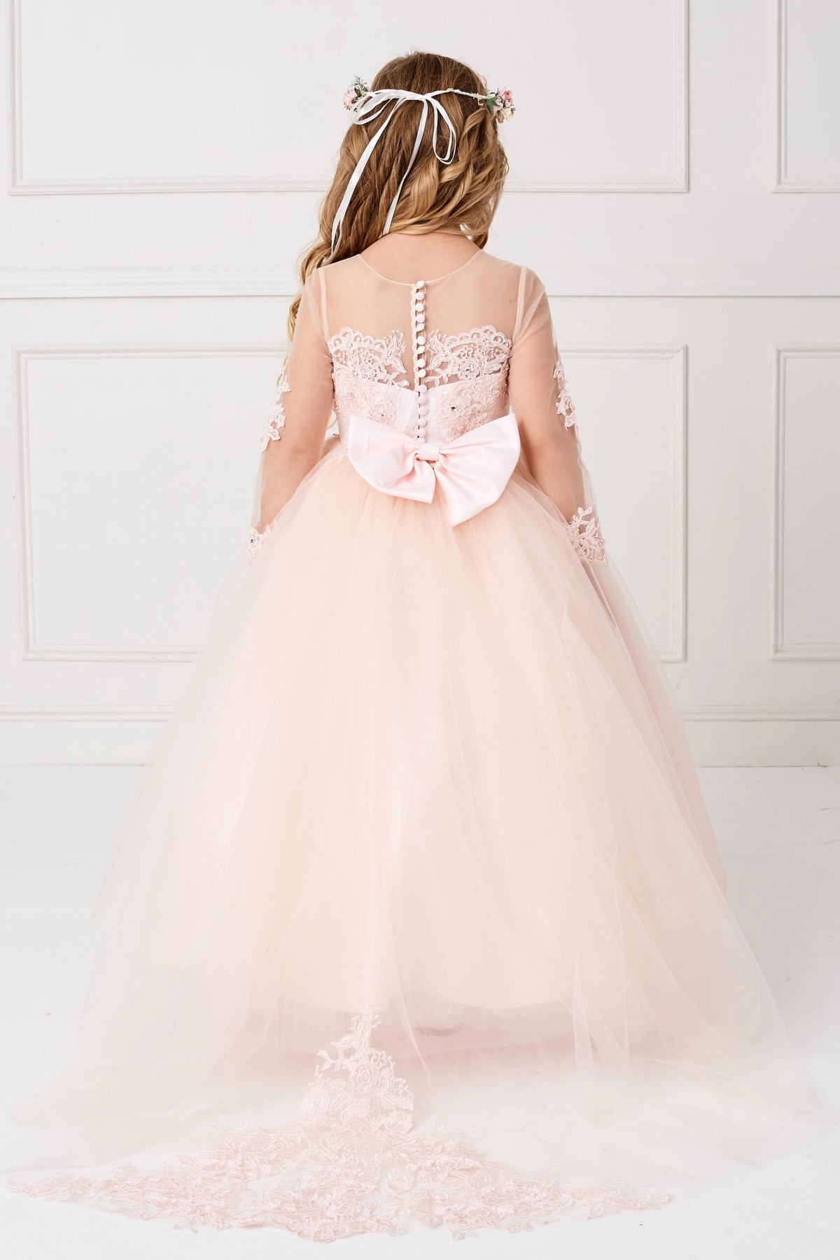 Blush kids pageant dress featuring the rear bodice and layered skirt.