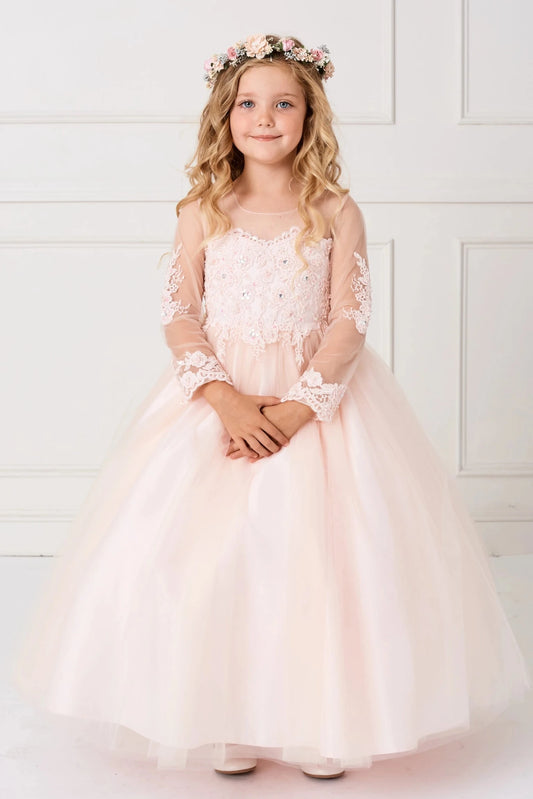 The Blush kids pageant dress has floral lace and sheer long sleeves.