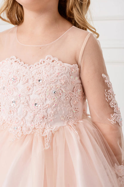 Seen from up close, this Blush kids pageant dress displays lace and sequins across the bodice.