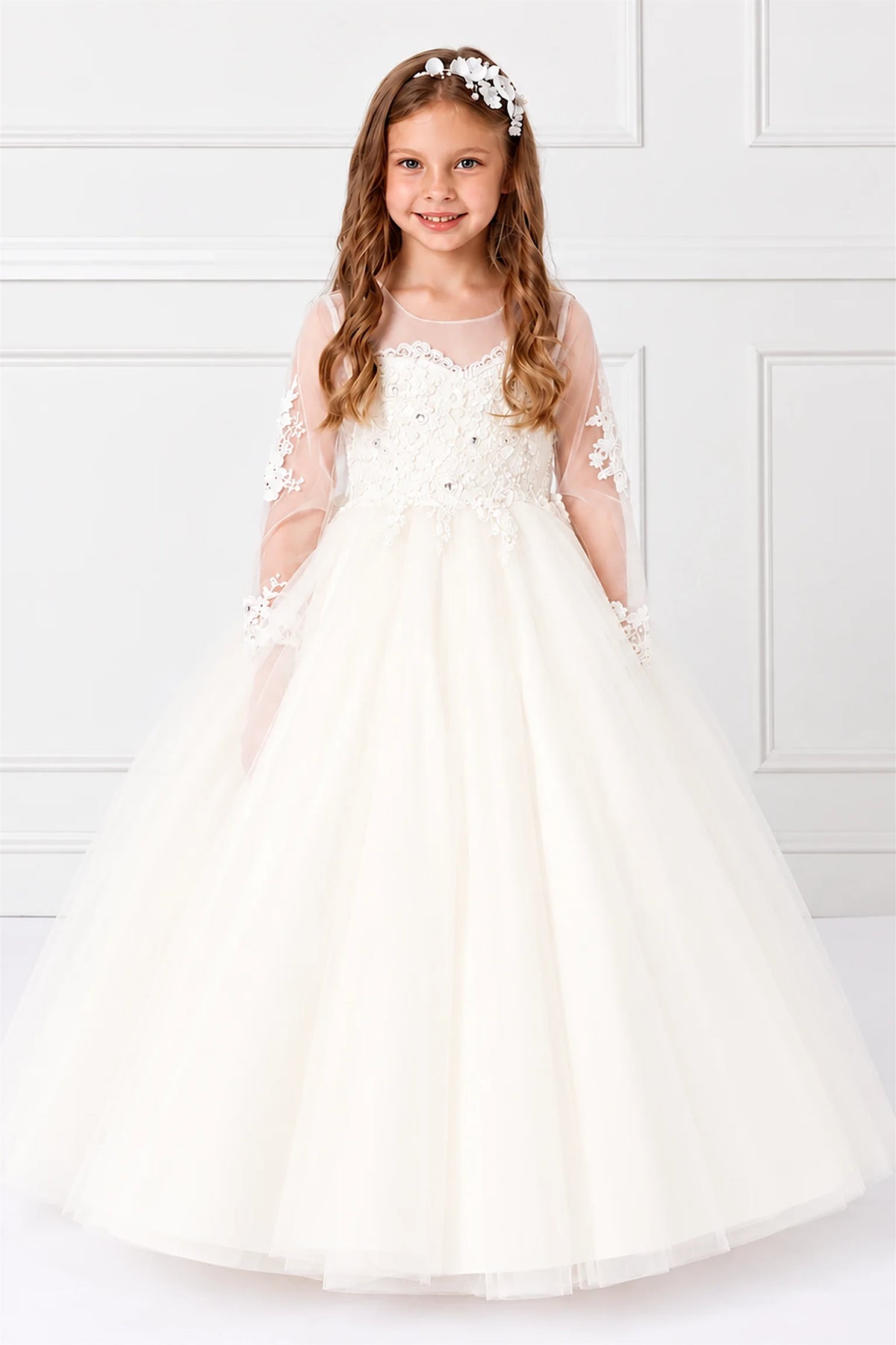 Ivory lace kids dress has a sheer neckline overlay above a full tulle skirt.