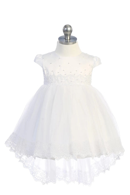 White christening dress with cap-sleeved satin bodice with pearls.