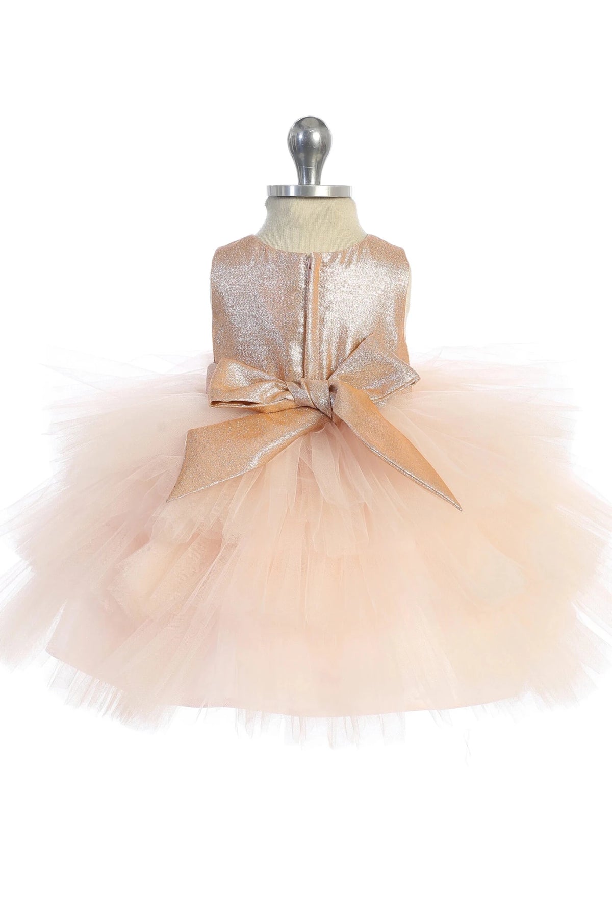 In view: a satin back sash of a rose gold flower girl dress.