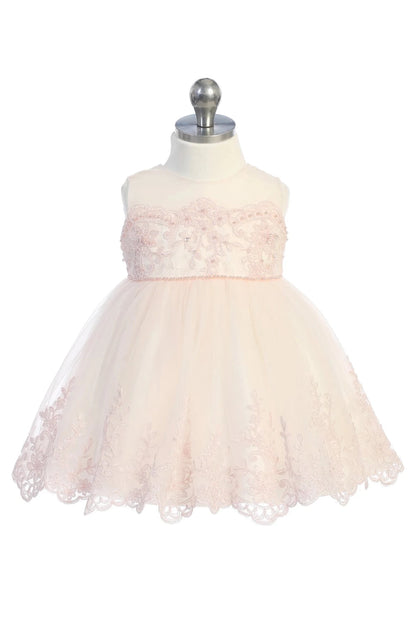 Flared blush flower girl dress edged in fine floral lace.