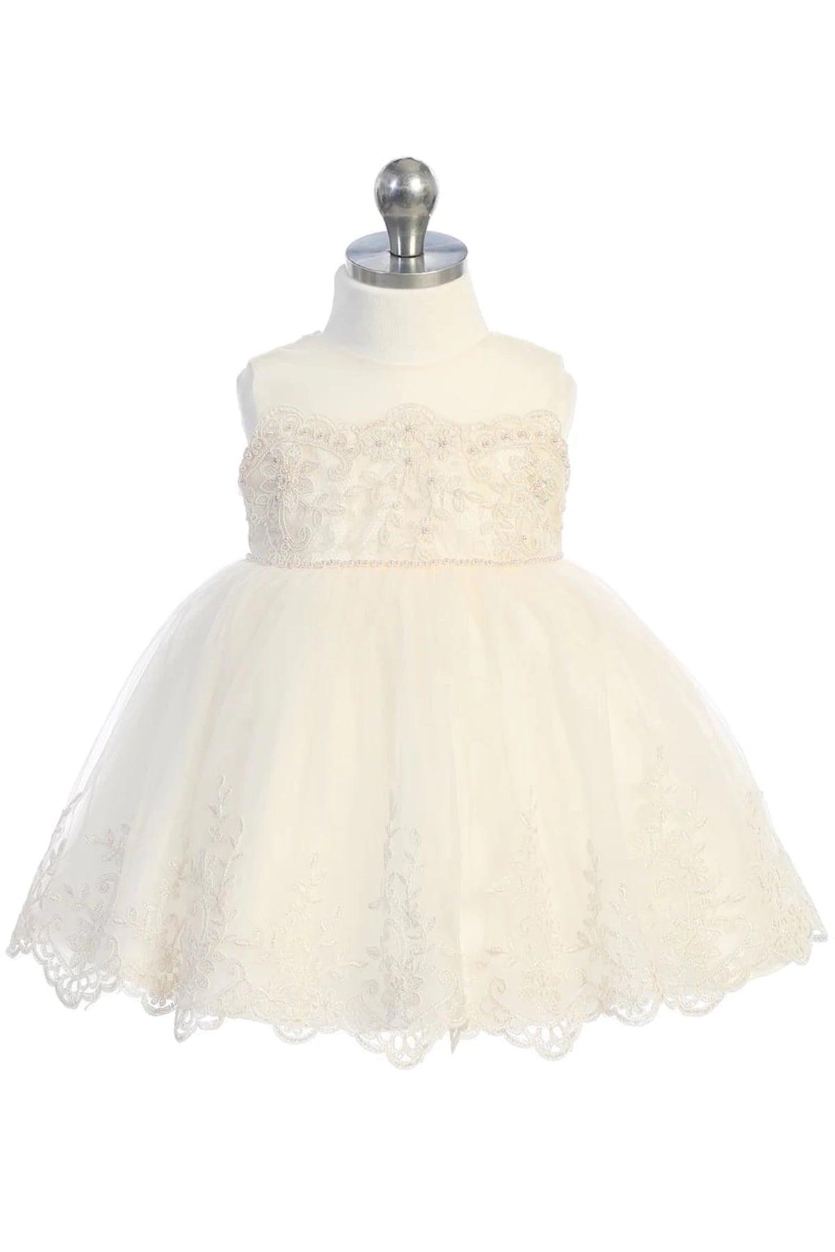 Scallops finish the champagne flower girl dress's full tulle skirt.