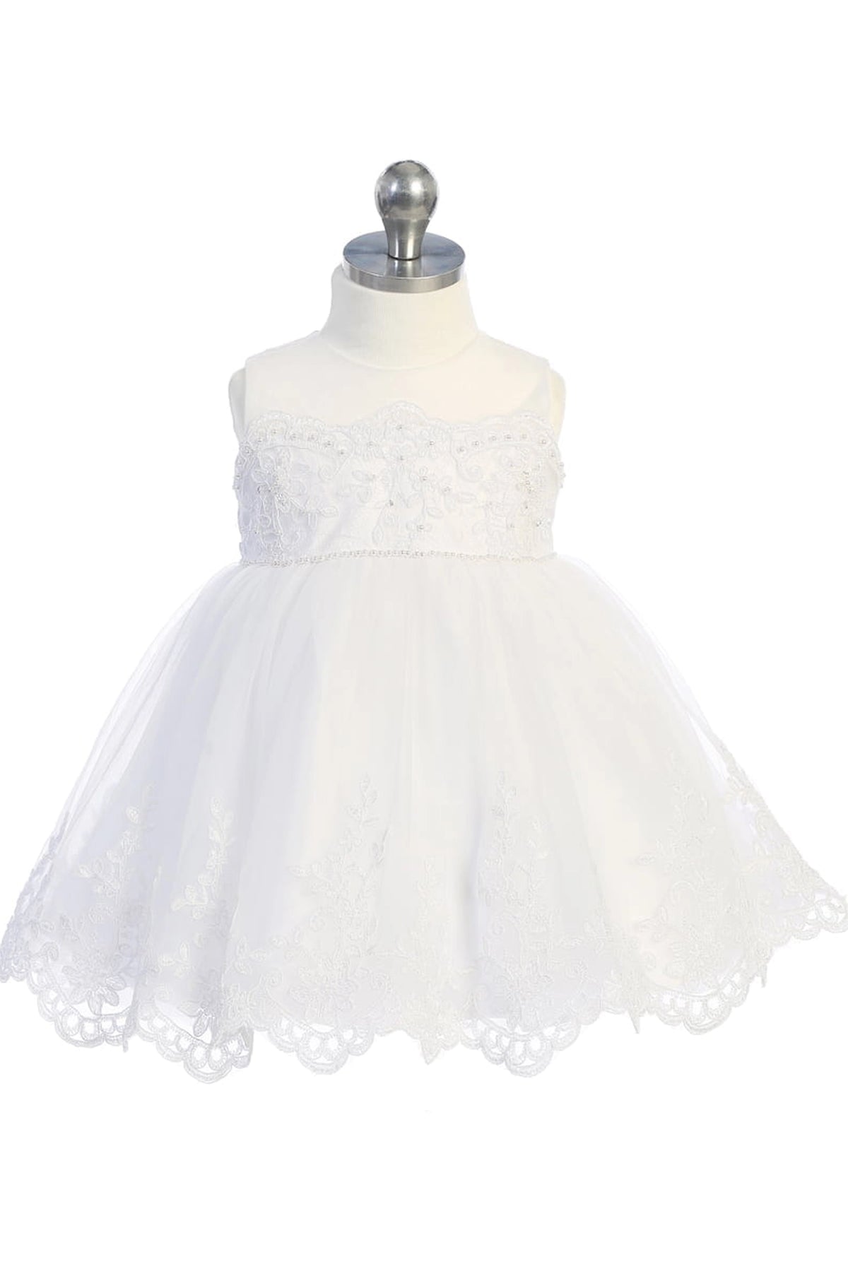 Bell-shaped tulle skirt on an off-white flower girl dress.