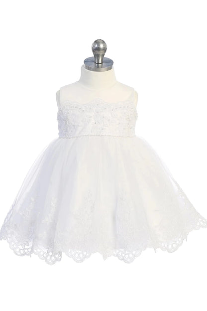Bell-shaped tulle skirt on an off-white flower girl dress.