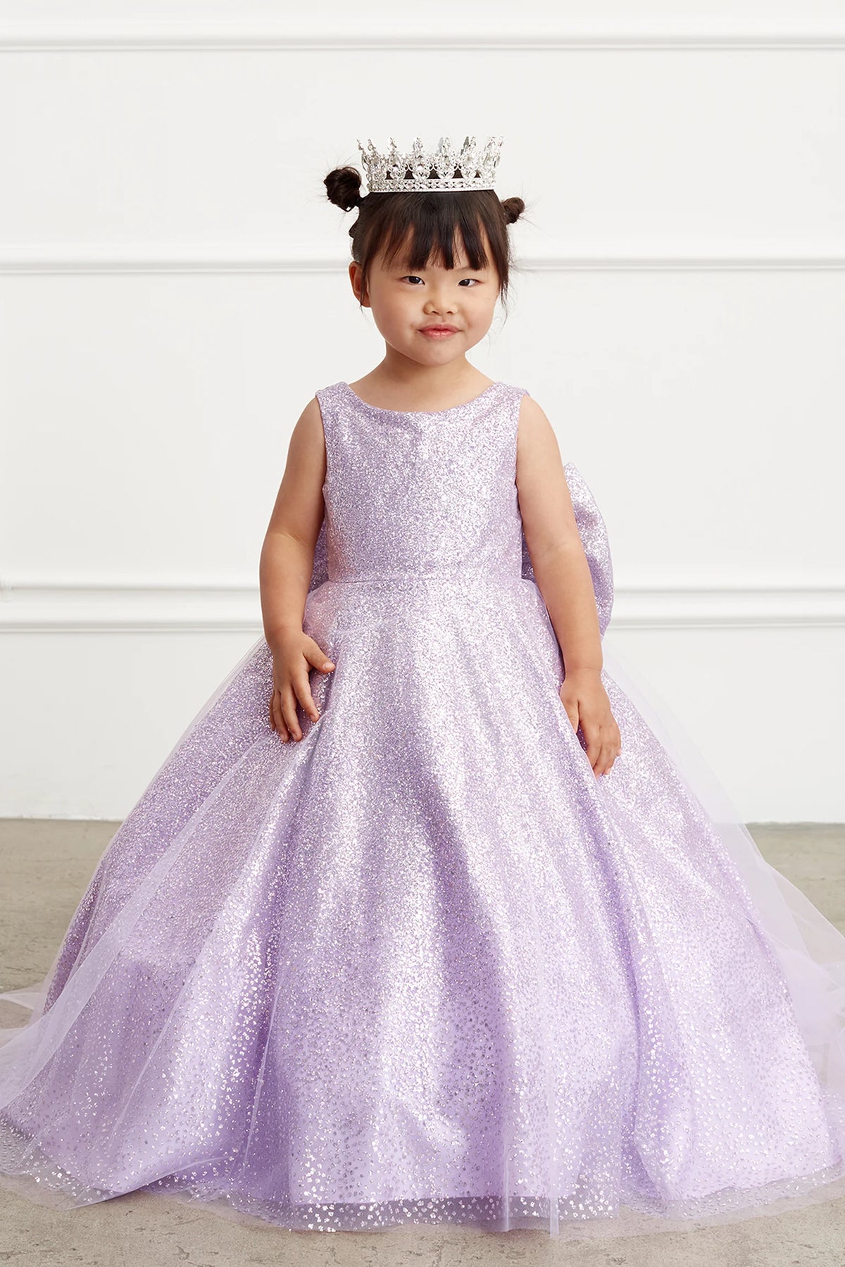 The Lilac kids pageant dress has a full glitter skirt.