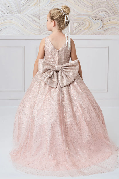 The Rose Gold kids pageant dress has a large glitter bow above the long back hem.
