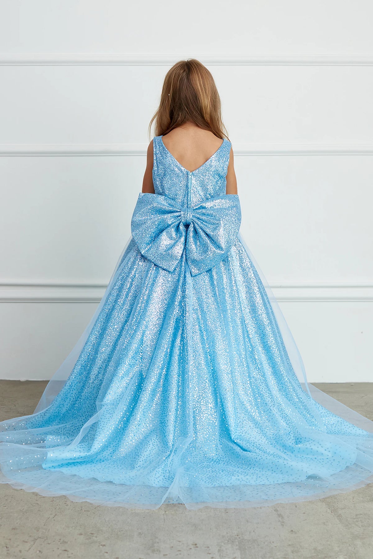 The Sky Blue kids pageant dress has a full glitter skirt.