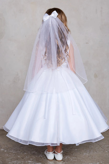 Wide back skirt on a white flower girl dress.