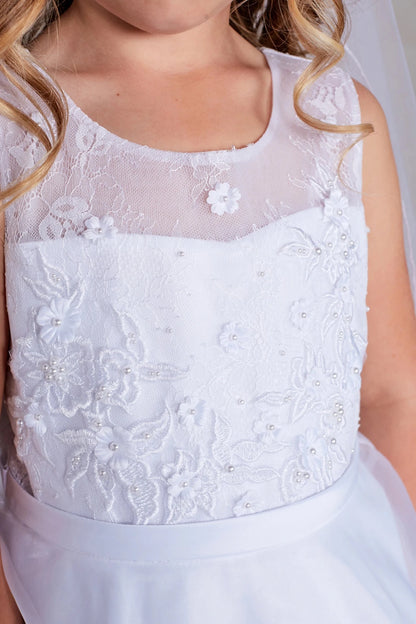 Visible on the white flower girl dress: a floral sheer yoke.
