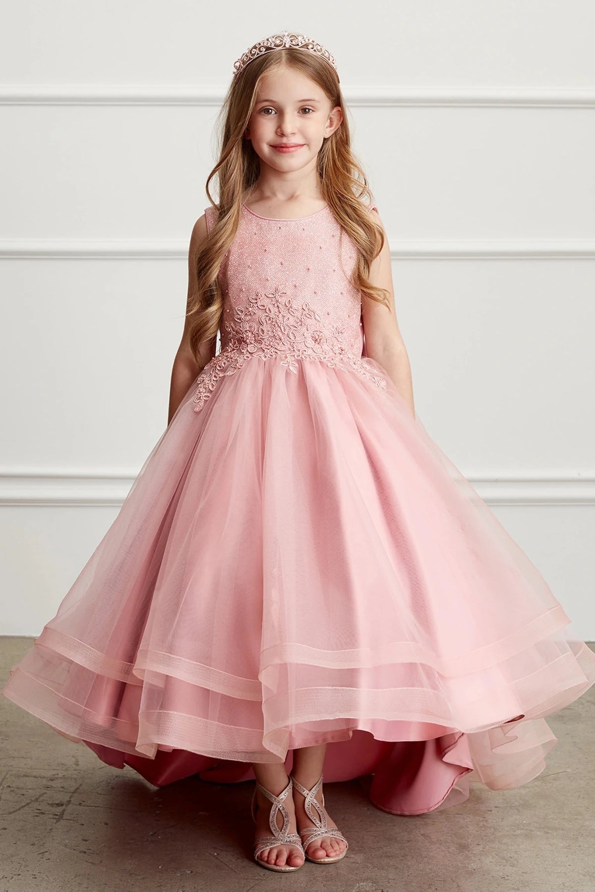Satin-edged skirt layers are visible on the mauve flower girl dress.
