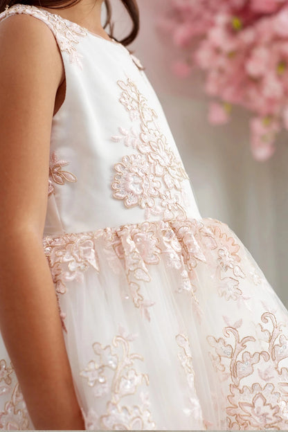 Floral bodice applique: detail of the blush flower girl dress.