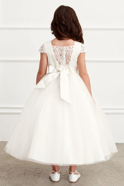 Highlighting an oversized satin back bow on an off-white flower girl dress.