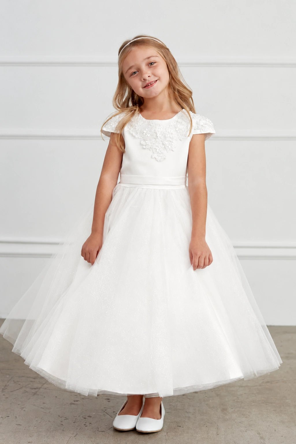 Off-White flower girl dress, showing lace cap sleeves.