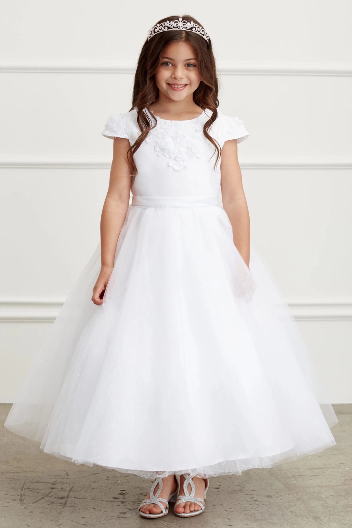 Visible on the white flower girl dress: small flutter sleeves.