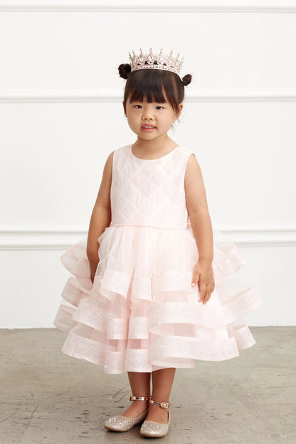 Blush kids pageant dress featuring a short tiered mesh skirt.