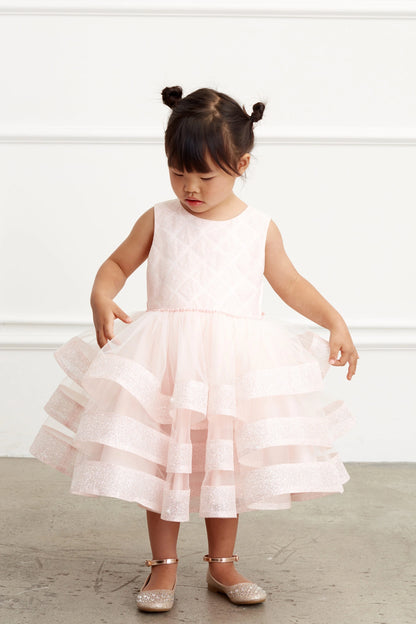 The Blush kids pageant dress has a tied sash across the back waist.