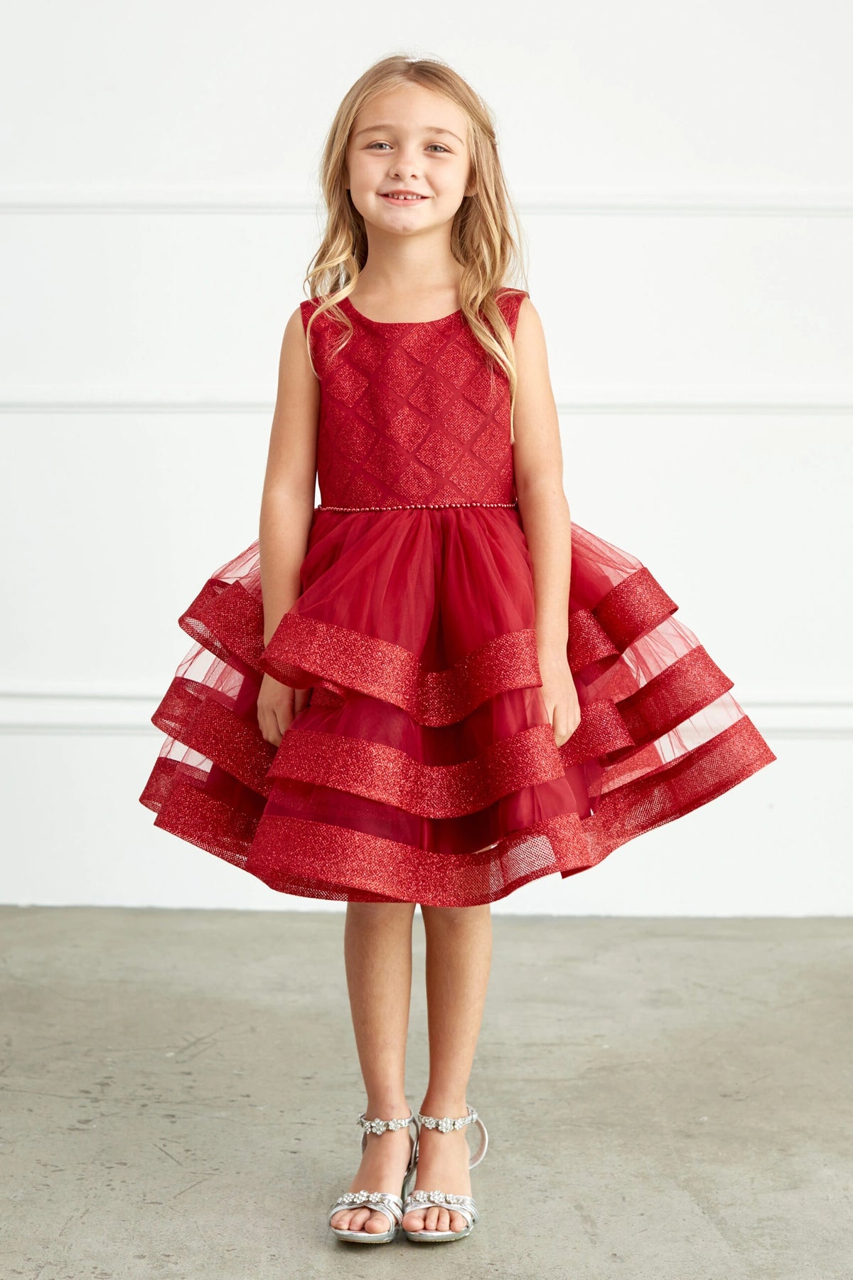 The Burgundy kids pageant dress has a short tiered mesh skirt.