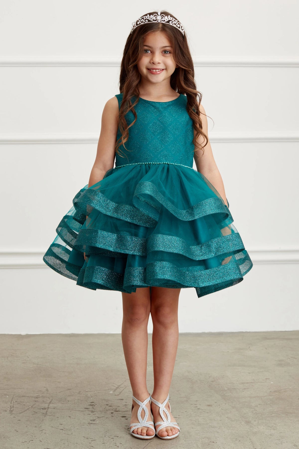 Emerald kids pageant dress featuring a short tiered mesh skirt.